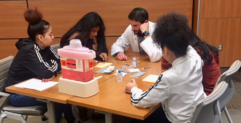 Dr. Ghidora teaches a class as part of international medical mission work.