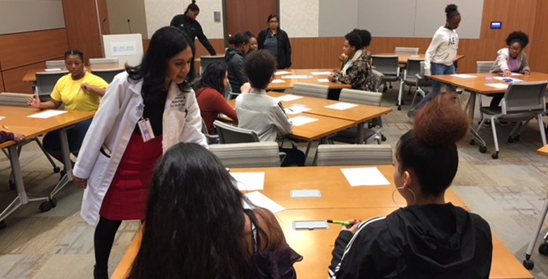 Dr. Ghidora teaches a class as part of international medical mission work.