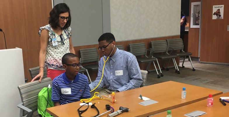 Members of the Hospitalist Team host a Medicine Day for the YMCA.