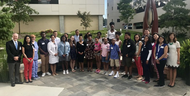 Group photo of Hospitalists and students from the YMCA