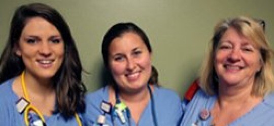 Three UNC REX registered nurses smiling for a picture