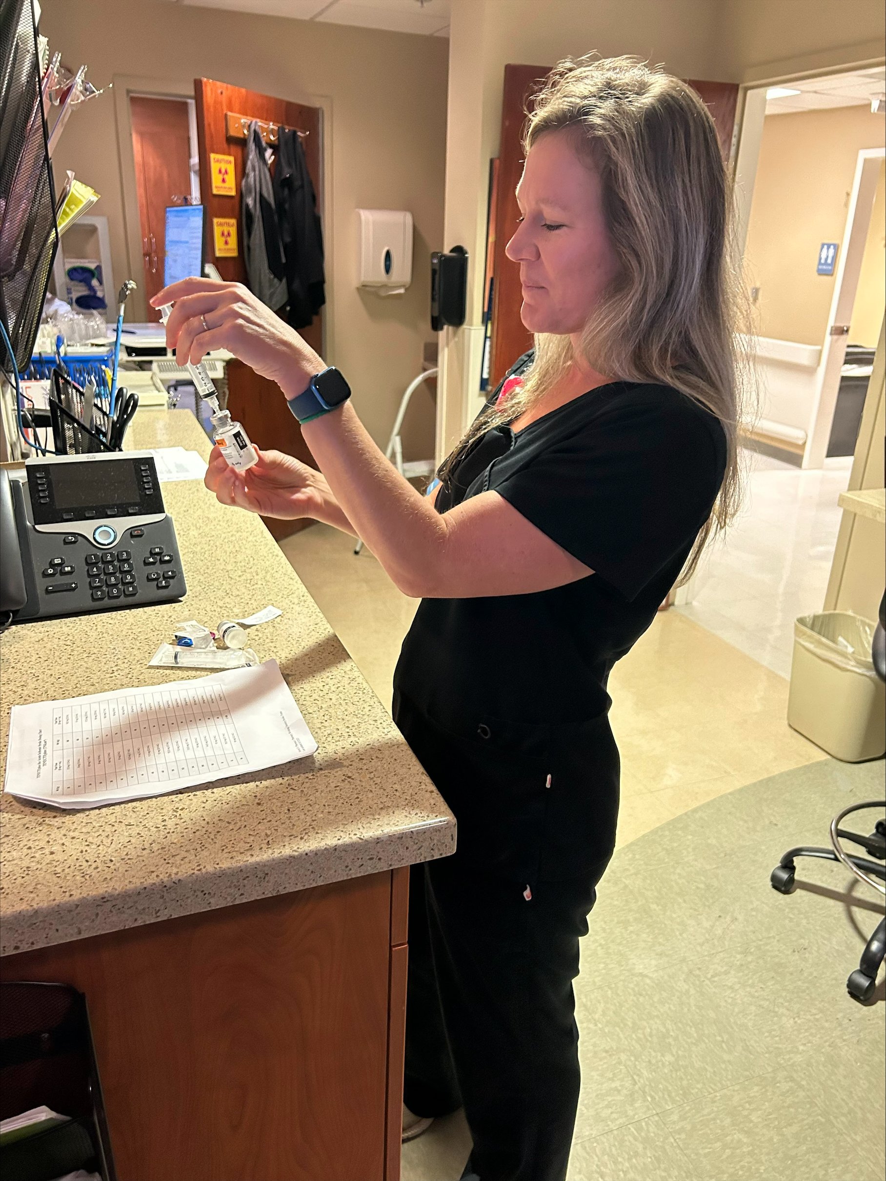 PGY2  Team Member fills a syringe from a bottle